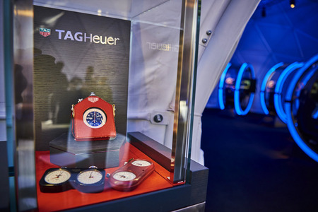Classic Tag Heuer stopwatches were displayed near the domes.
