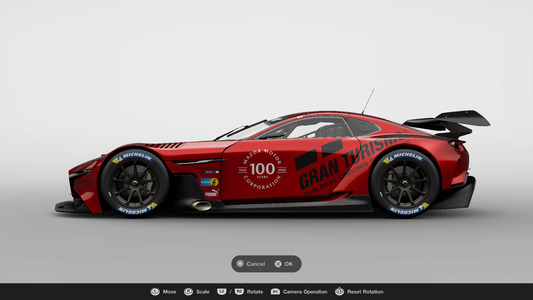 7. Place the 'Mazda 100th Anniversary' logo decal on the MAZDA RX-VISION GT3 CONCEPT body. The location of the decal is up to you.